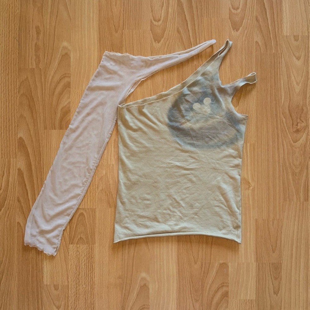 Beige cut out assymetrical tank and mesh sleeve